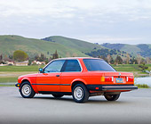 AUT 01 RK0338 01
1984 BMW 318i Red 3/4 Rear View On Pavement By Hills