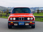 AUT 01 RK0339 01
1984 BMW 318i Red Front View On Pavement By Hills