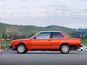 AUT 01 RK0340 01
1984 BMW 318i Red Profile View On Pavement By Hills