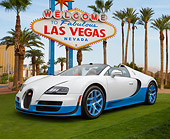 AUT 02 RK0150 01
Bugatti Veyron 16.4 Grand Sport Vitesse SE White And Blue 3/4 Front View On Grass By Las Vegas Sign