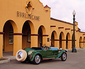 AUT 02 RK0034 03
1926 Bugatti Type 38 Torpedo Tourer Green 3/4 Rear View On Pavement By Building