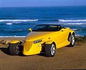 AUT 03 RK0012 07
1999 Plymouth Prowler Roadster Yellow 3/4 Front View On Beach Ocean Background