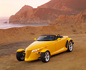 AUT 03 RK0019 04
1999 Plymouth Prowler Roadster Yellow 3/4 Front View On Beach