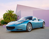 AUT 04 BK0001 01
2013 Lotus Evora Coupe Blue 3/4 Front View On Pavement By Building