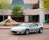 AUT 04 RK0045 01
1999 Lotus Esprit V8 Silver Front 3/4 View On Pavement By Water Fountain