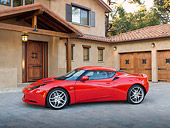 AUT 04 RK0181 01
2013 Lotus Evora Red 3/4 Side View On Brick By House