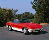 AUT 04 RK0081 02
1972 Lotus Elan S4 Convertible Red And White Front 3/4 View On Pavement By Trees