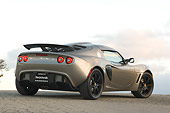 AUT 04 RK0131 01
2006 Lotus Exige Silver 3/4 Rear View On Pavement Blue Sky