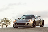 AUT 04 RK0132 01
2006 Lotus Exige Silver Front 3/4 View On Pavement Blue Sky