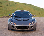AUT 04 RK0139 01
2006 Lotus Exige Silver Head On View On Pavement By Grass Hills Blue Sky