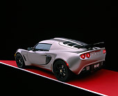 AUT 04 RK0148 02
2006 Lotus Exige Silver 3/4 Rear View Shot On Gray Line Red Floor Studio