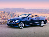 AUT 05 BK0009 01
2011 Mercedes-Benz E550 Cabriolet Blue 3/4 Side View On Pavement By San Francisco Skyline