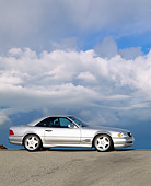 AUT 05 RK0069 05
1997 Mercedes-Benz 500SL Sport Silver 3/4 Side View On Pavement Hill Clouds