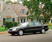 AUT 05 RK0160 01
2000 Mercedes-Benz S500 Almandin Black 3/4 Side View On Pavement By House