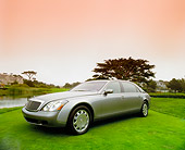 AUT 05 RK0359 02
2004 Maybach 62 Sedan Two-Tone Silver 3/4 Front View On Grass Filtered