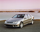 AUT 05 RK0373 03
2005 Mercedes C55 AMG Sports Sedan Silver 3/4 Front View By Water