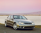 AUT 05 RK0374 02
2005 Mercedes C55 AMG Sports Sedan Silver 3/4 Front View By Water