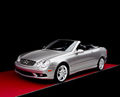 AUT 05 RK0386 01
2005 Mercedes-Benz CLK55 Convertible Silver 3/4 Front View On Red Floor Studio
