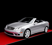 AUT 05 RK0386 02
2005 Mercedes-Benz CLK55 Convertible Silver 3/4 Front View On Red Floor Studio