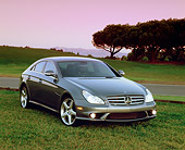 AUT 05 RK0474 02
2006 Mercedes Benz CLS55 AMG Gray 3/4 Front View On Grass Trees Background