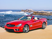 AUT 05 RK0612 01
2010 Mercedes-Benz SL63 Convertible Red 3/4 Front View On Beach
