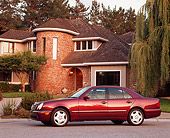 AUT 05 RK0013 02
1999 Mercedes-Benz E420 Sedan Sport Burgundy 3/4 Front View On Pavement By House