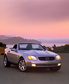 AUT 05 RK0033 02
1998 Mercedes-Benz SLK Kompressor Convertible Silver 3/4 Front View On Pavement Pink Sky