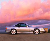 AUT 05 RK0072 04
1997 Silver 500SL Mercedes Sport Profile On Pavement At Dusk Blue Sky Purple Clouds