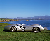 AUT 05 RK0213 03
1954 Mercedes W196 Race Car Silver Profile View On Grass By Water Pebble Beach