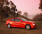 AUT 05 RK0240 03
2002 Mercedes-Benz C230 Kompressor Red 3/4 Side View On Dirt By Trees Filtered