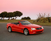 AUT 05 RK0271 01
2003 Mercedes SL500 Red Convertible 3/4 Side View On Pavement By Trees Filtered