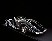 AUT 05 RK0349 06
1937 Mercedes-Benz 540K Special Roadster Black 3/4 Rear View On Gray Floor Studio