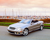 AUT 05 RK0377 02
2005 Mercedes CLK55 Silver Convertible 3/4 Front View On Pavement By Harbor Filtered