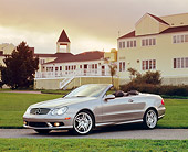 AUT 05 RK0381 01
2005 Mercedes-Benz CLK55 Convertible Silver 3/4 Side View On Grass By Building