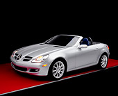 AUT 05 RK0389 02
2005 Mercedes-Benz SLK350 Convertible Silver 3/4 Side View On Red Floor Studio