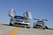 AUT 05 RK0448 02
Mercedes-Benz 2005 SLR McLaren And 1956 300SL Silver Doors Open On Pavement