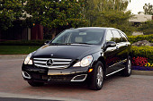 AUT 05 RK0451 01
2006 Mercedes-Benz R500 Black 3/4 Front View On Pavement By Flowers
