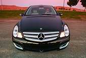 AUT 05 RK0458 01
2006 Mercedes Benz R500 Black Head On Shot On Pavement By Grass Hills