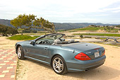 AUT 05 RK0485 01
2006 Mercedes-Benz SL500 Convertible Blue 3/4 Rear View Mountains Background