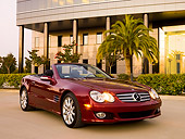 AUT 05 RK0508 01
2007 Mercedes-Benz SL550 Roadster Storm Red 3/4 Front View On Pavement By Building
