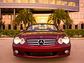 AUT 05 RK0509 01
2007 Mercedes-Benz SL550 Roadster Storm Red Low Head On View On Pavement By Building