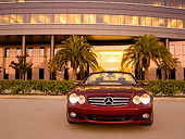 AUT 05 RK0510 01
2007 Mercedes-Benz SL550 Roadster Storm Red Low Head On View On Pavement By Building