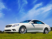 AUT 05 RK0567 01
2007 Mercedes-Benz CL550 White Front 3/4 View Low Angle On Grass Blue Sky