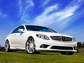 AUT 05 RK0568 02
2007 Mercedes-Benz CL550 White Front 3/4 View Low Angle On Grass Blue Sky