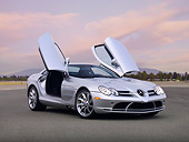 AUT 05 RK0572 01
2006 Mercedes-Benz SLR McLaren Silver 3/4 Front View Doors Open On Pavement