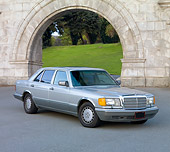 AUT 05 RK0574 01
1986 Mercedes-Benz 420 SEL Silver 3/4 Front View On Pavement By Stone Arch