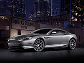 AUT 06 BK0004 01
2012 Aston Martin DB9 Gray 3/4 Front View In City At Night