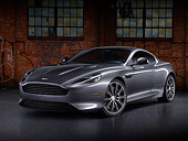 AUT 06 BK0007 01
2012 Aston Martin DB9 Gray 3/4 Front View By Brick Building With Graffiti