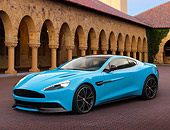 AUT 06 BK0009 01
2013 Aston Martin Vanquish Blue 3/4 Front View On Brick By Building With Columns