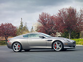 AUT 06 RK0129 01
2009 Aston Martin DB9 Silver Profile View On Pavement By Trees